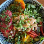 lettuce salad with vegetables and shrimp in bowl