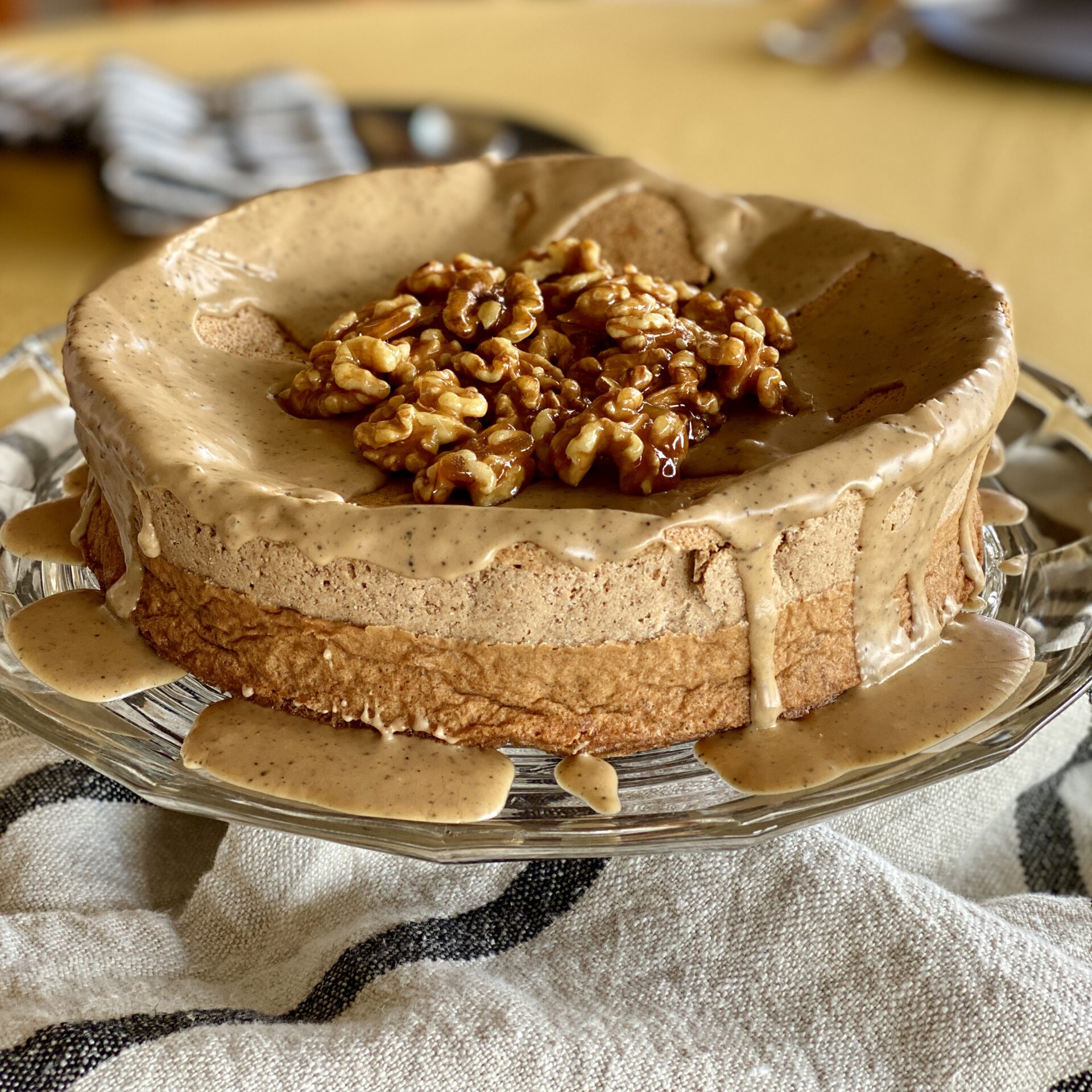 Flourless walnut cake on a cake platter.