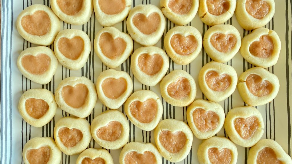 Finished Valentine Shortbread Heart Cookies grouped together on a platter.
