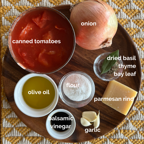 A platter holding all the ingredients for The World's Best Tomato Soup