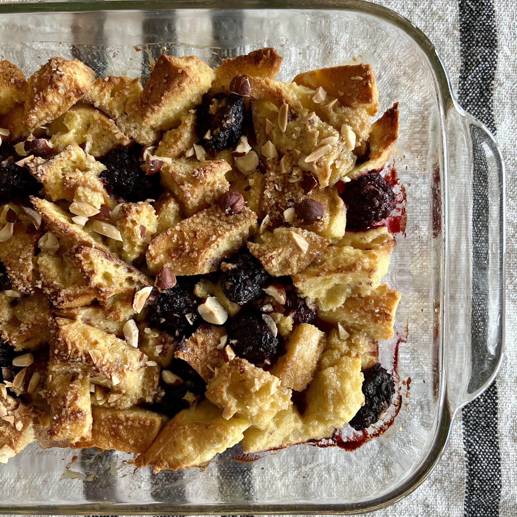 a baking dish of baked french toast and berries
