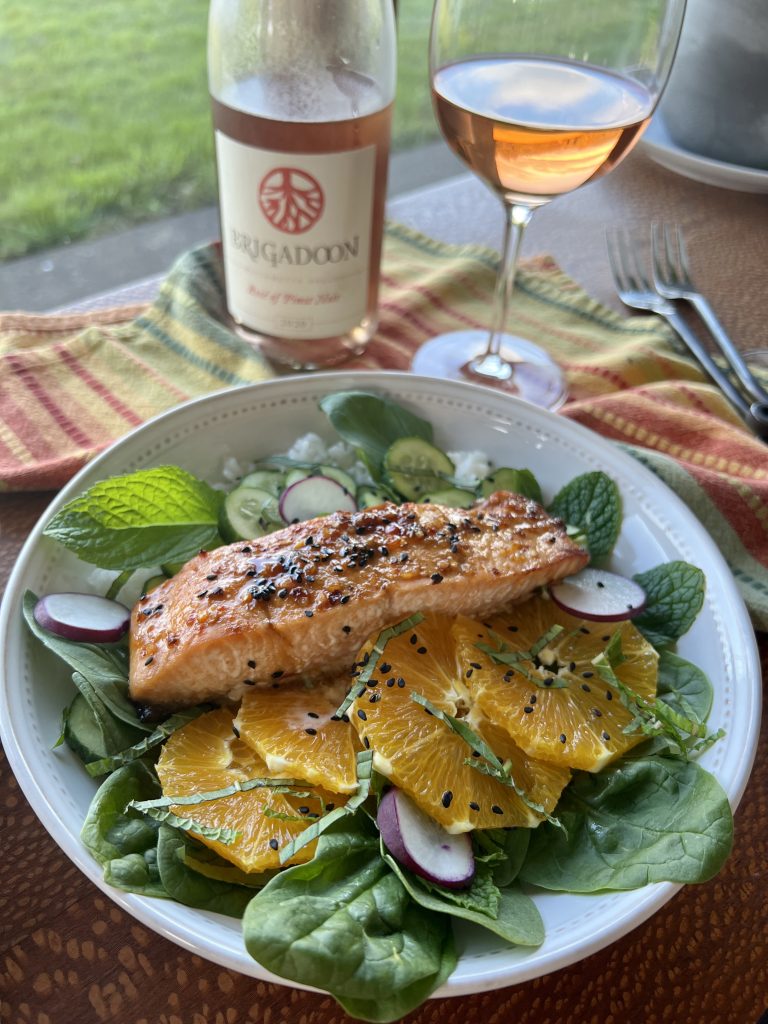 Salmon bowl with a glass of Oregon Rose.