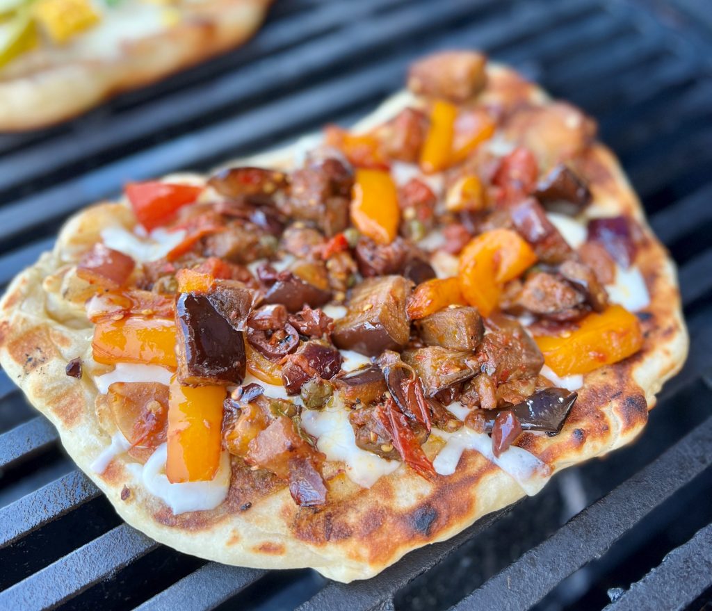 Caponata pizza on the grill.