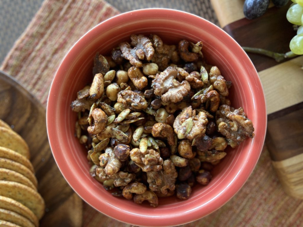 A bowl of spiced candied cocktail nuts