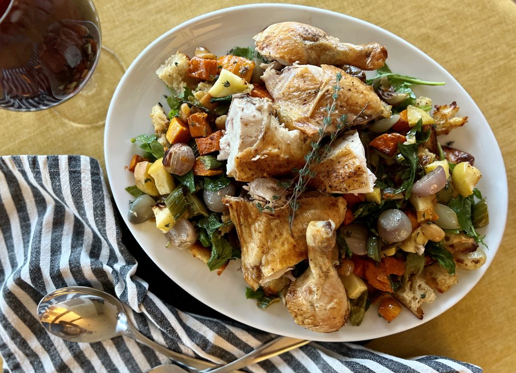 A platter of roasted chicken and autumn bread salad.
